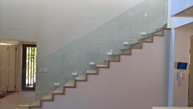 Frameless Glass Balustrades on a Straight Staircase.